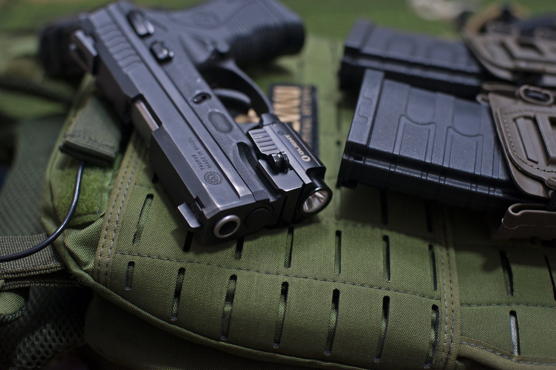 pistol beside loaded cartridges