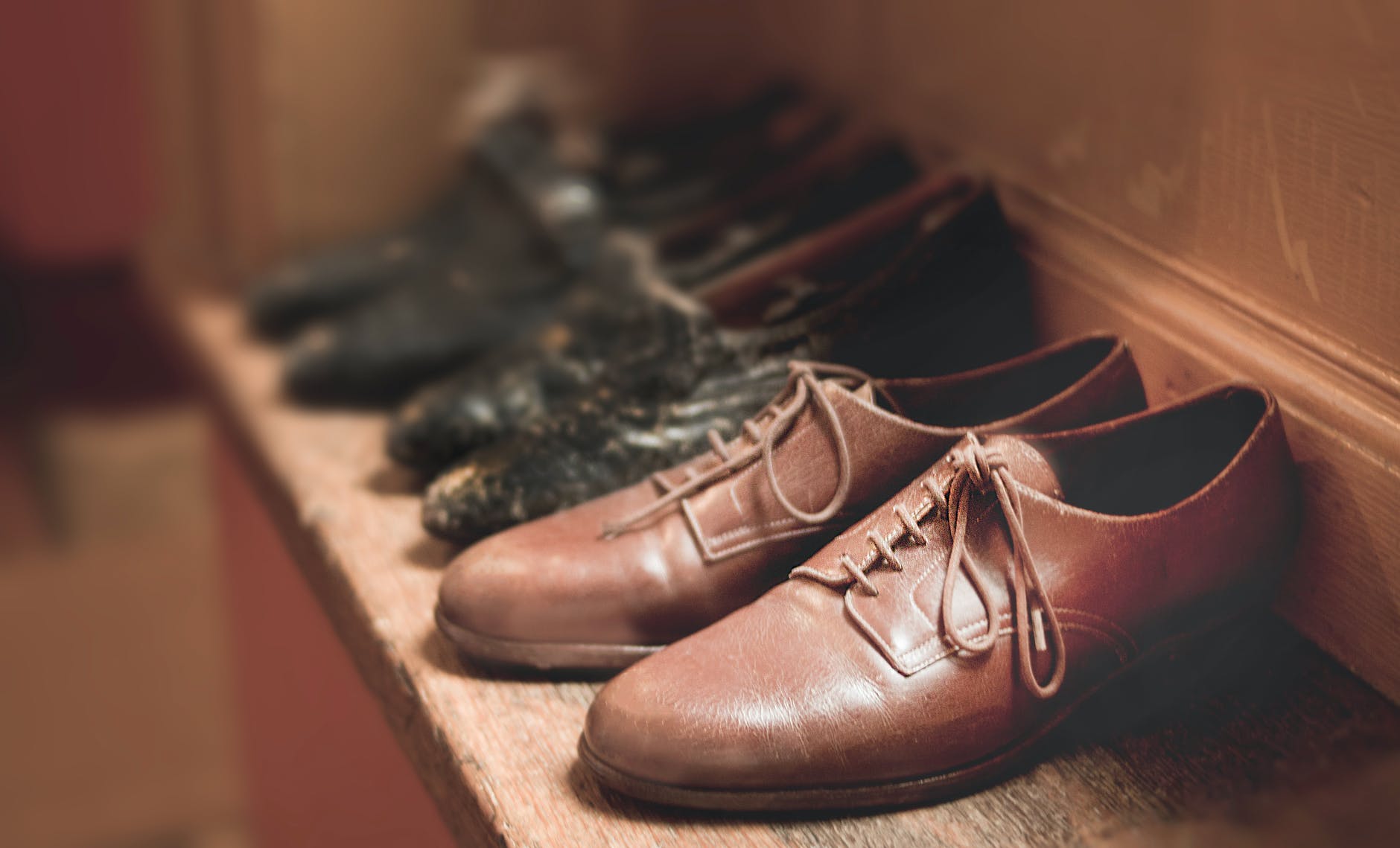 close up photography of brown leather shoes