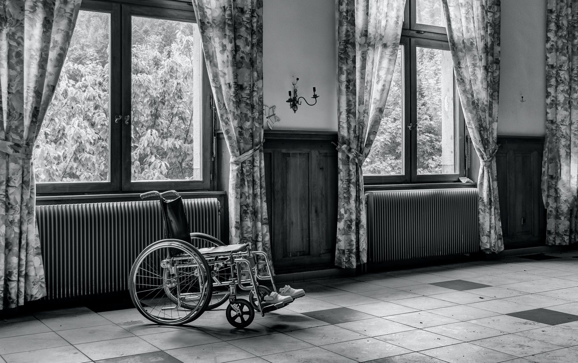 grayscale photo of wheelchair